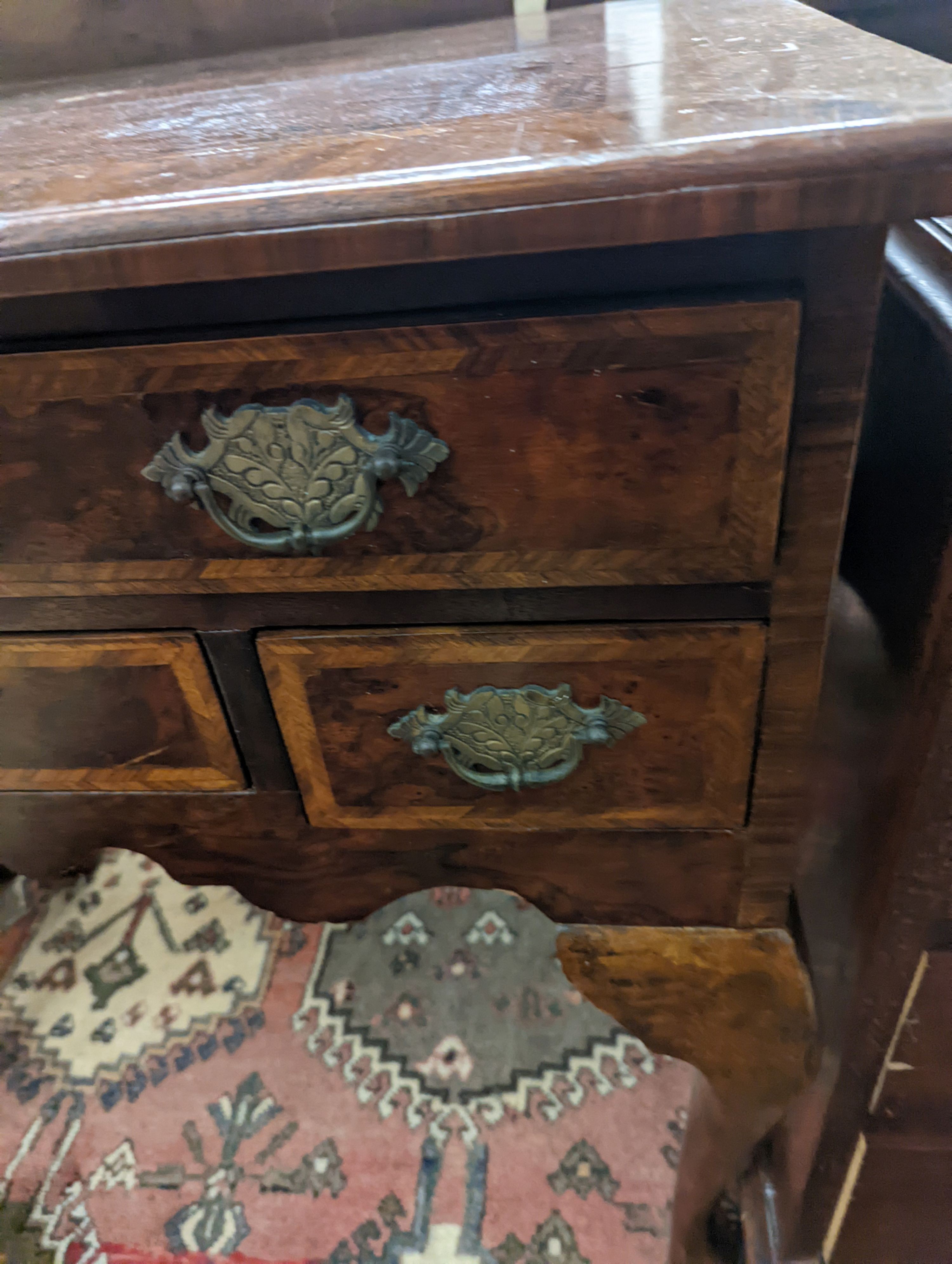 A George I style banded figured walnut lowboy, width 74cm, depth 44cm, height 76cm